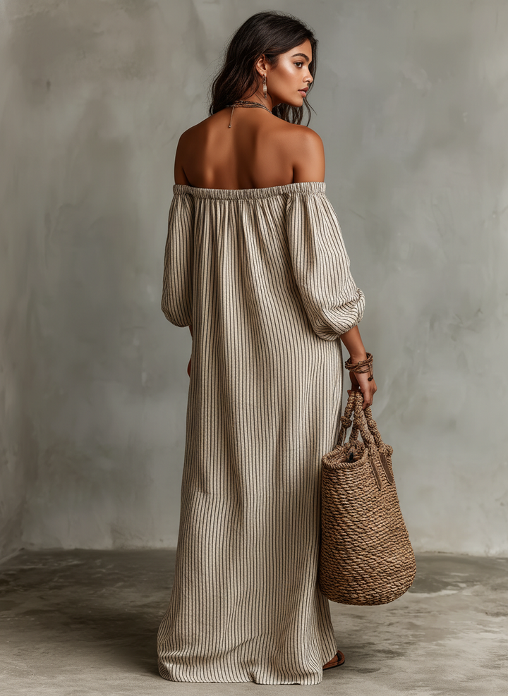 Chic women's off-shoulder striped maxi dress featuring puff sleeves, perfect for summer vacation style.