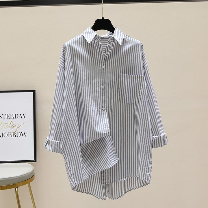 Preppy women's oversized striped longline shirt, button down, versatile for various casual fashion occasions.
