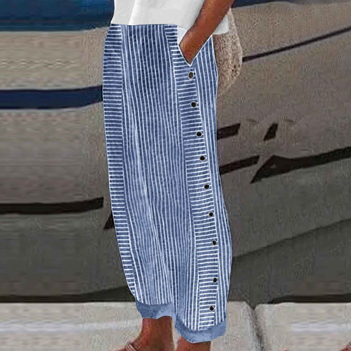 Chic women's striped pants with unique button accents. Relaxed fit offers versatile, comfortable everyday fashion.
