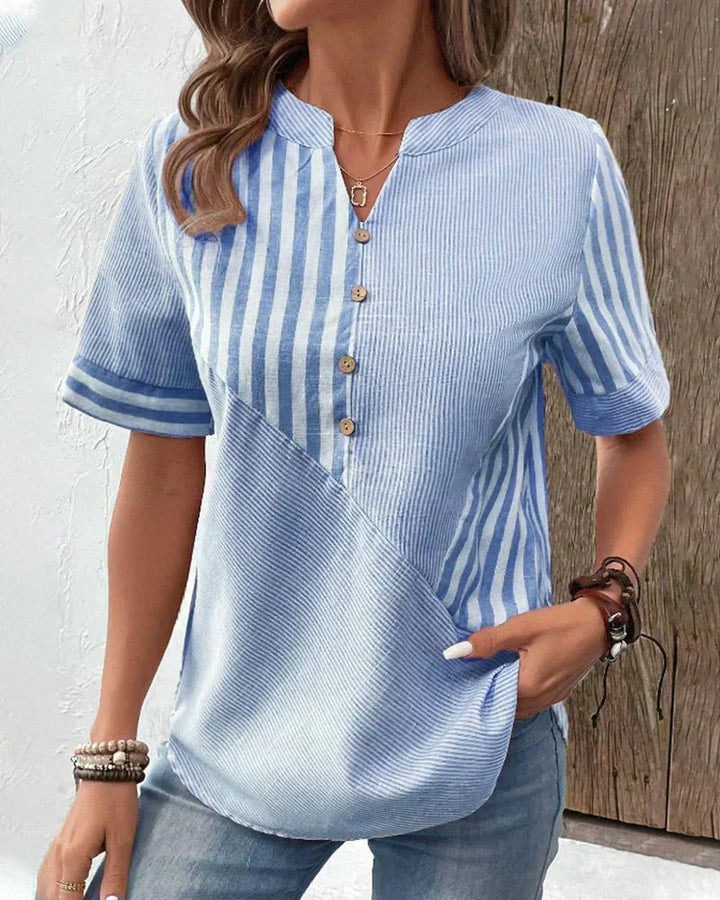 Stylish women's striped short sleeve top. An effortless and versatile blouse for any occasion.
