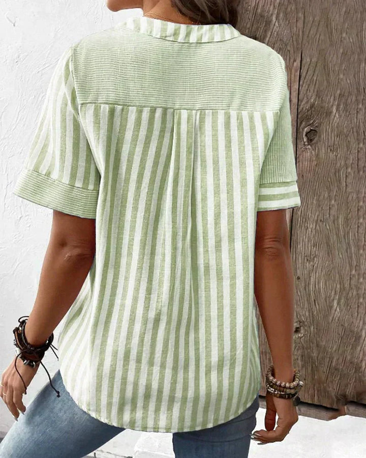 Versatile women's striped short sleeve blouse offering everyday comfort & effortless style.