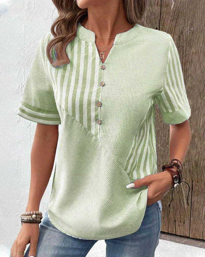 Women's striped short sleeve blouse. Elegant, comfortable, and versatile for spring, summer, and office.