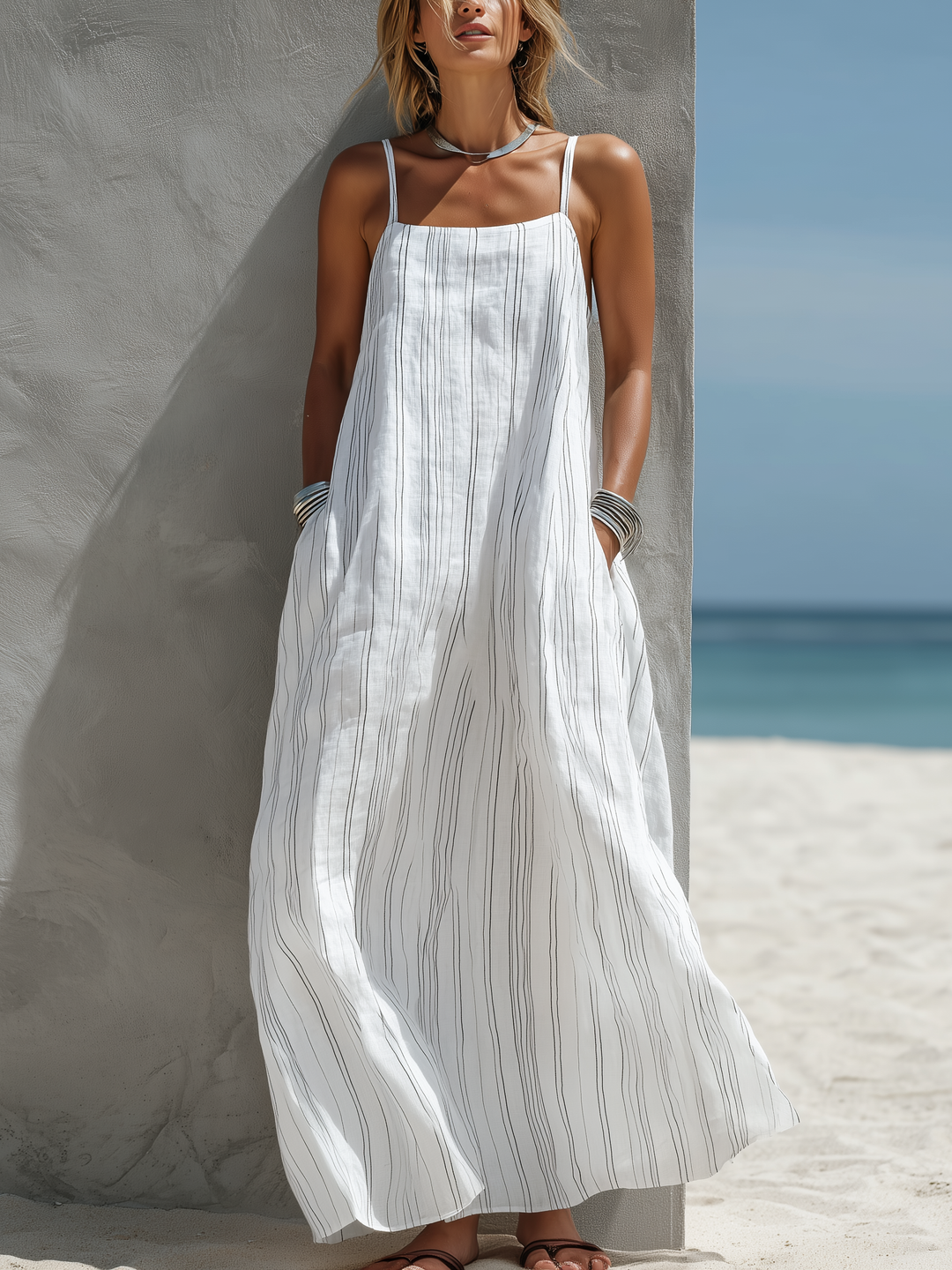 Women's striped spaghetti strap maxi dress with square neck. Ideal for beach, summer vacation, or casual day wear.