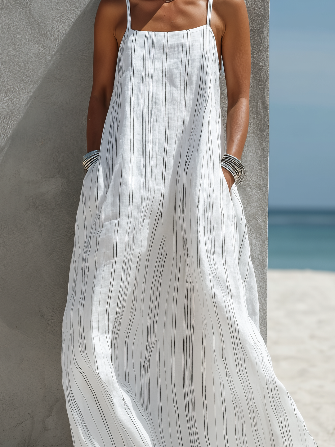 Stylish women's striped maxi dress with spaghetti straps & square neck. A versatile summer vacation or day dress option.