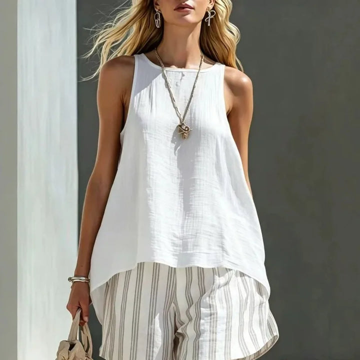 Women's striped shorts with a comfortable fit, paired with a tank top for a chic summer outfit.