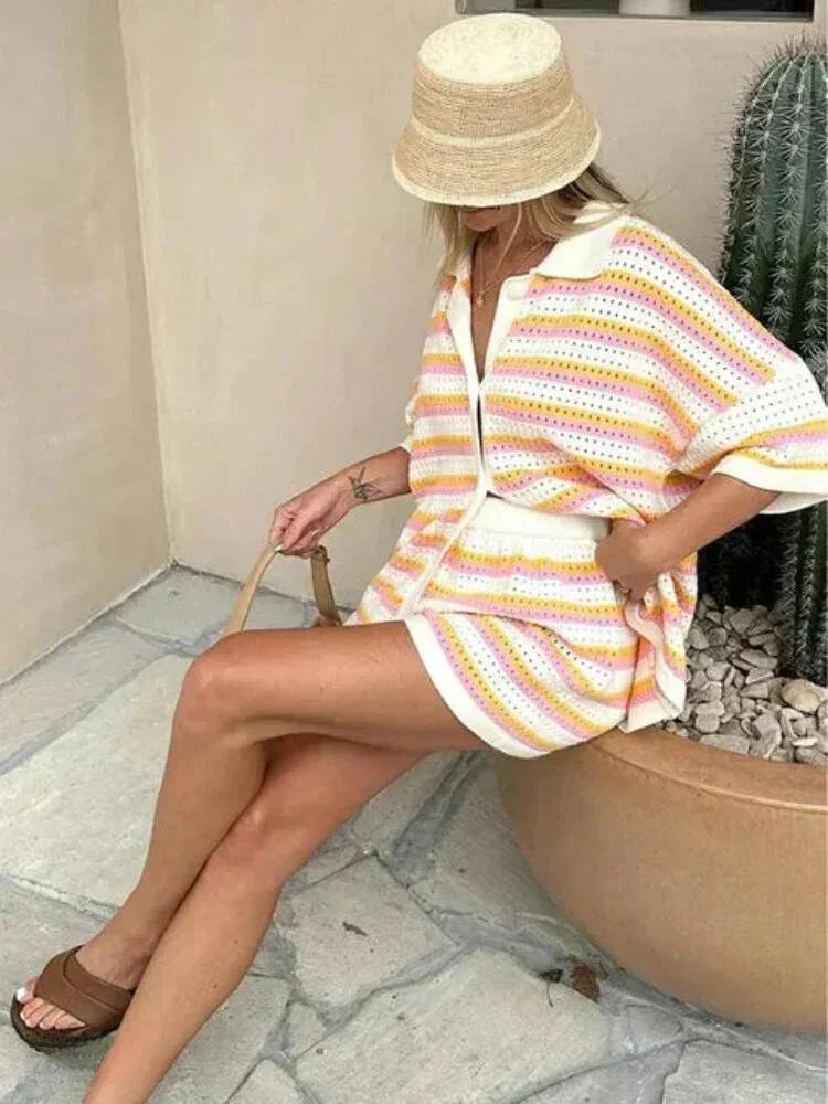 Comfortable women's striped two-piece loungewear set. Relaxed fit shorts & button-up top, ideal for casual summer style.