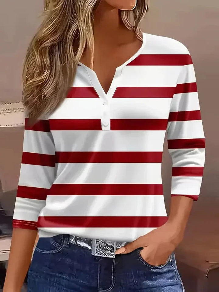 Women's striped v-neck blouse with three-quarter sleeves, perfect for stylish everyday comfort.