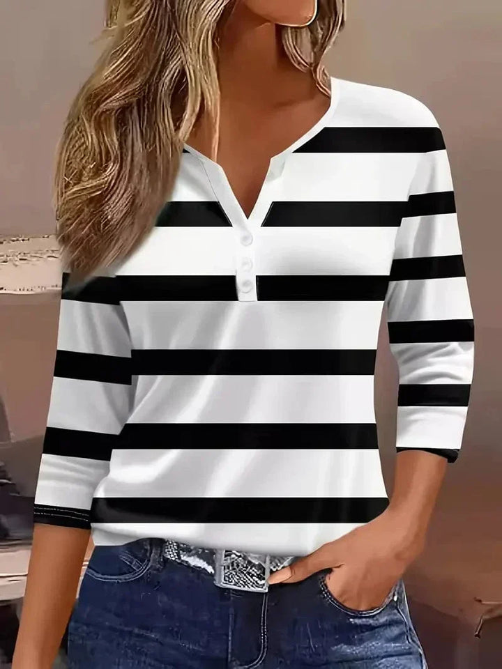 Classic striped v-neck women's blouse with three-quarter sleeves, a versatile top for casual or office wear.