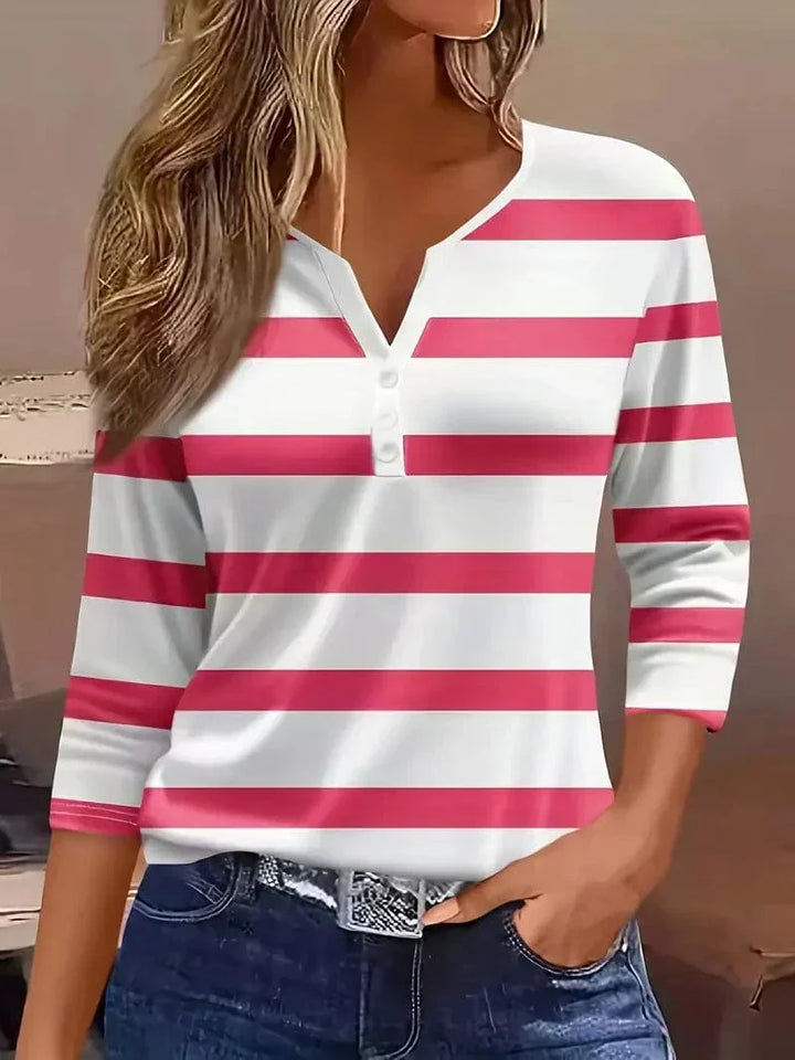 Fashionable women's striped v-neck blouse, featuring three-quarter sleeves and stylish button accents.