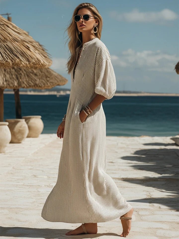 Relaxed fit women's striped maxi dress with V-neck, puff sleeves, and side split. Perfect casual summer outfit.