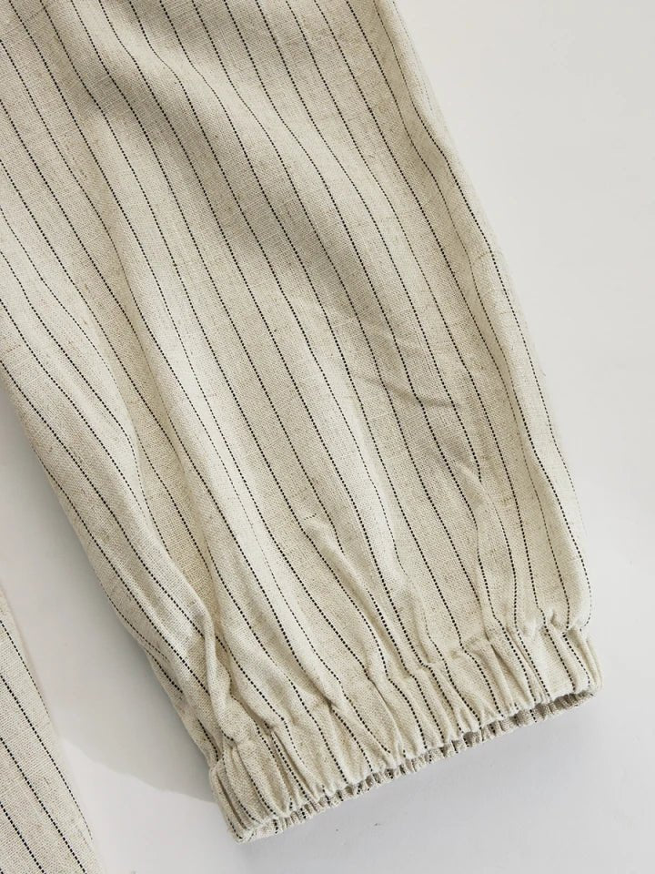 Women's striped V-neck maxi dress, puff sleeves, side split. A chic button-down for warm weather & travel.