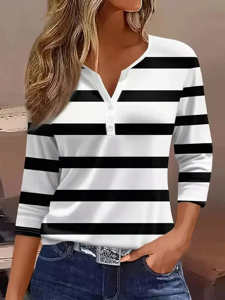Modern women's striped V-neck shirt. Effortless short sleeve top, ideal for summer and everyday fashion.