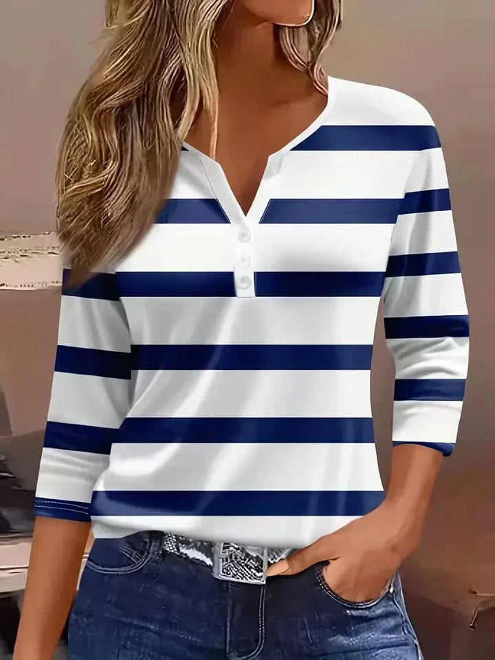 Comfortable women's short sleeve V-neck top with stripes. A stylish and versatile blouse for casual wear.