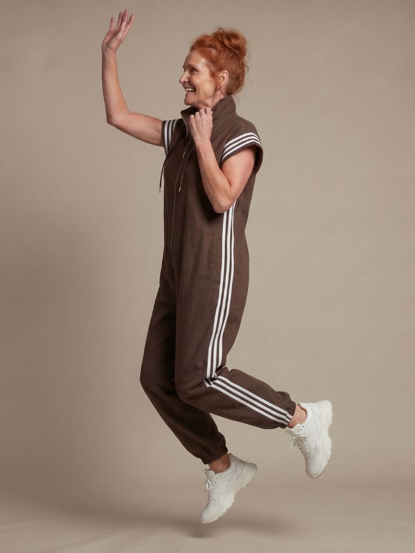 Relaxed fit striped zip front jumpsuit, comfortable women's everyday fashion.