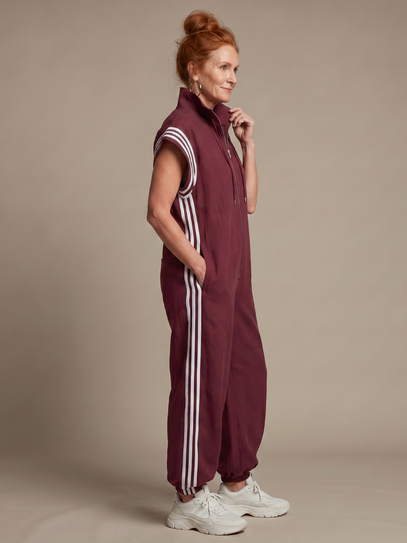 Relaxed fit striped jumpsuit with zip front, perfect one piece for everyday style.