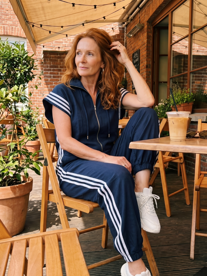 Versatile women's striped jumpsuit, zip front, wide sleeve, elegant & comfortable.