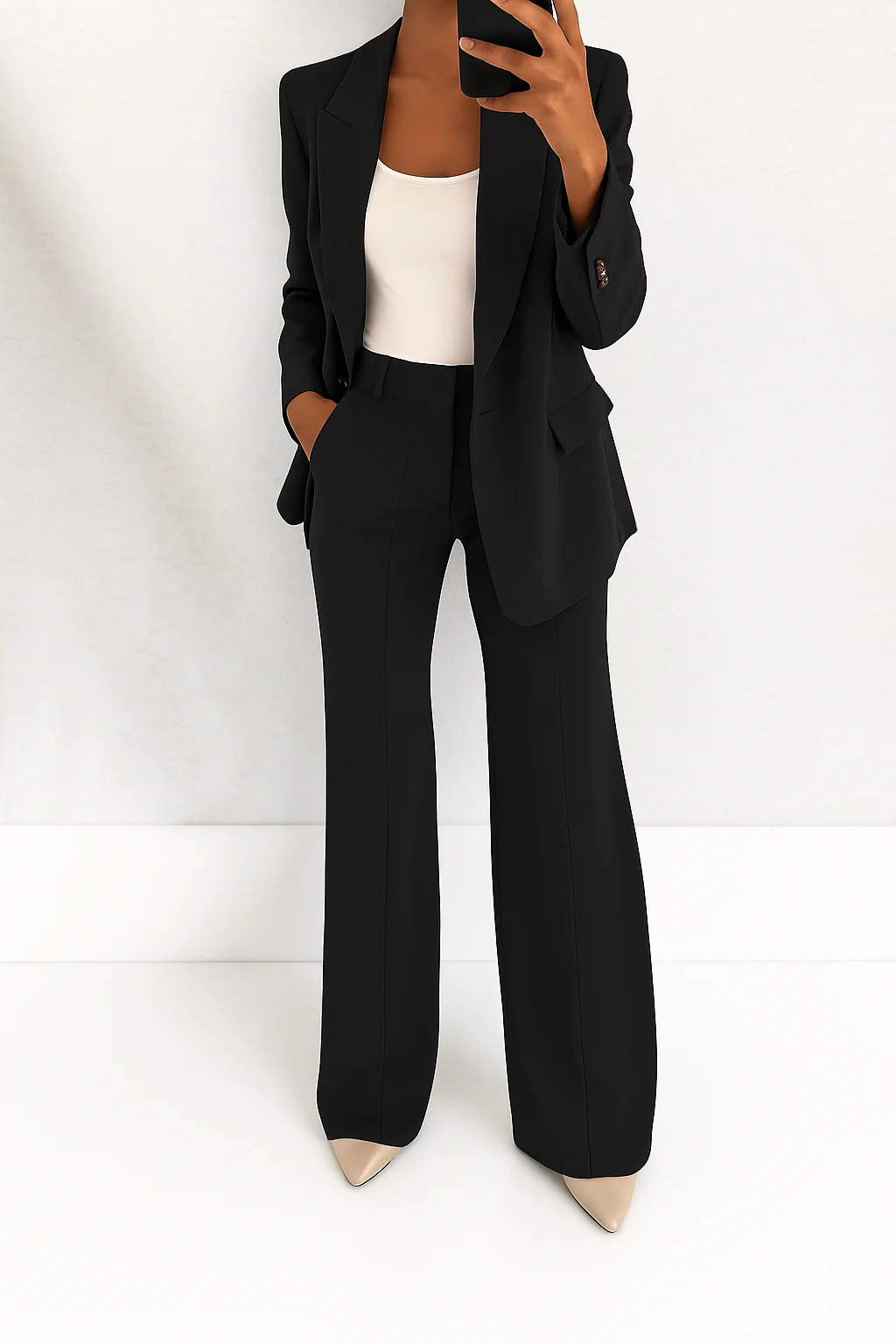 Assertive women's power suit set with structured blazer & trousers for sharp business fashion.