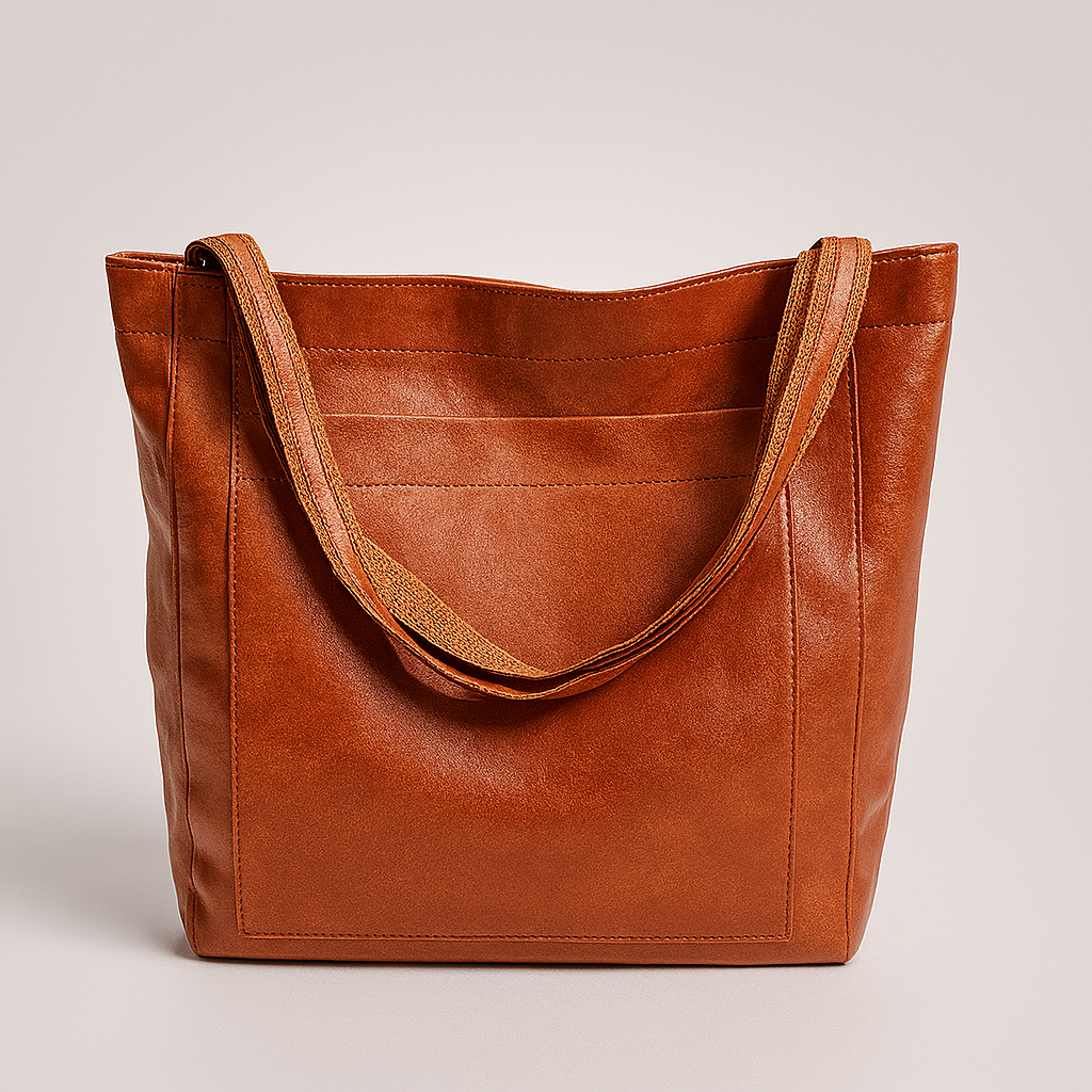 Women's structured brown tote bag with exterior pocket, ideal for work, daily essentials. Versatile fashion accessory.