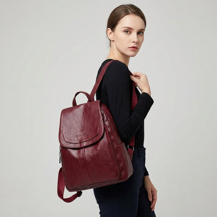 Stylish women's structured flap backpack. Fashionable daily bag with adjustable straps for comfort & versatility.
