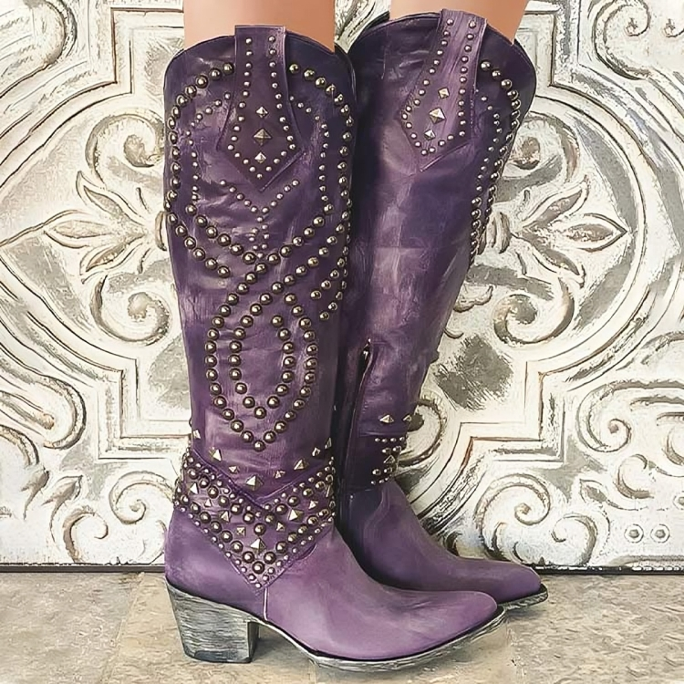 Women's studded knee-high western cowboy boots in black, featuring intricate stud detailing. Perfect fashion & festival footwear.