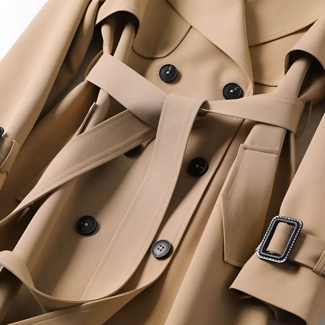 Stylish women's fall trench coat, water-resistant fabric, features classic double-breasted design.