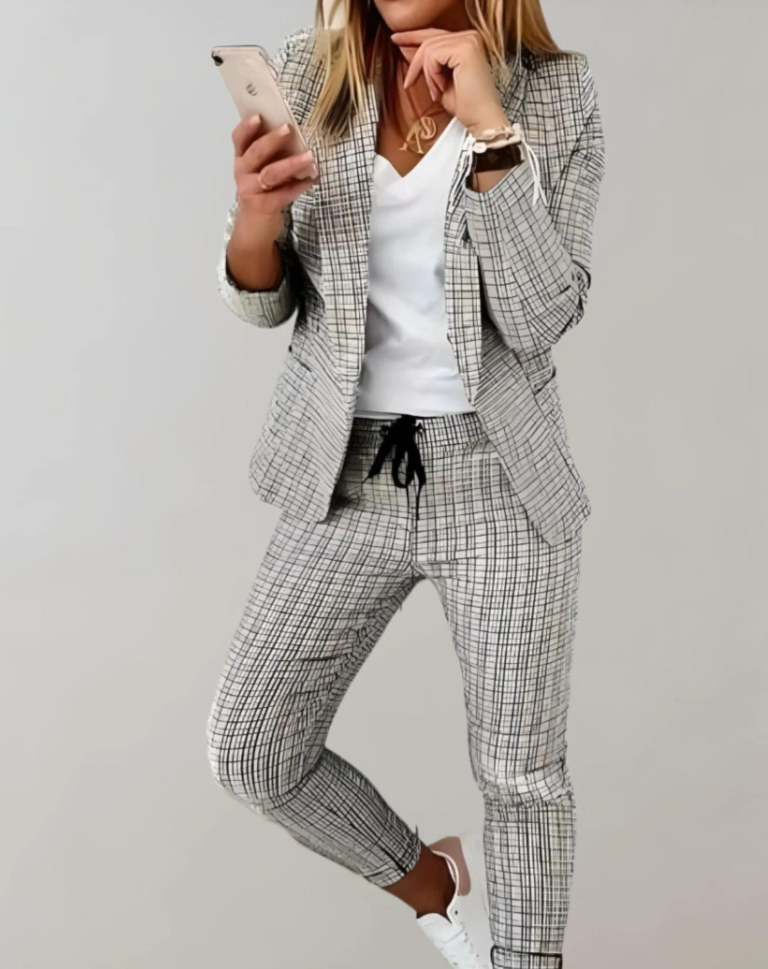 Chic women's co-ord blazer and trousers set, ideal for spring fashion or a smart casual look.