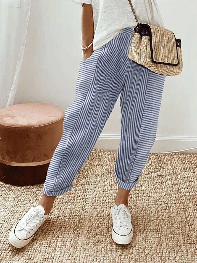 Women's stylish cropped striped pants with functional pockets, perfect for comfortable everyday wear.