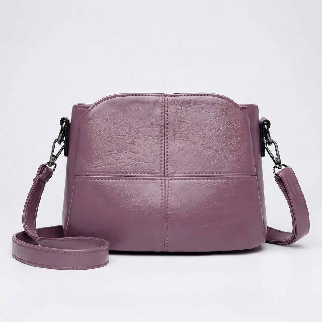 Stylish women's crossbody shoulder bag, versatile mini handbag with elegant stitched detailing.