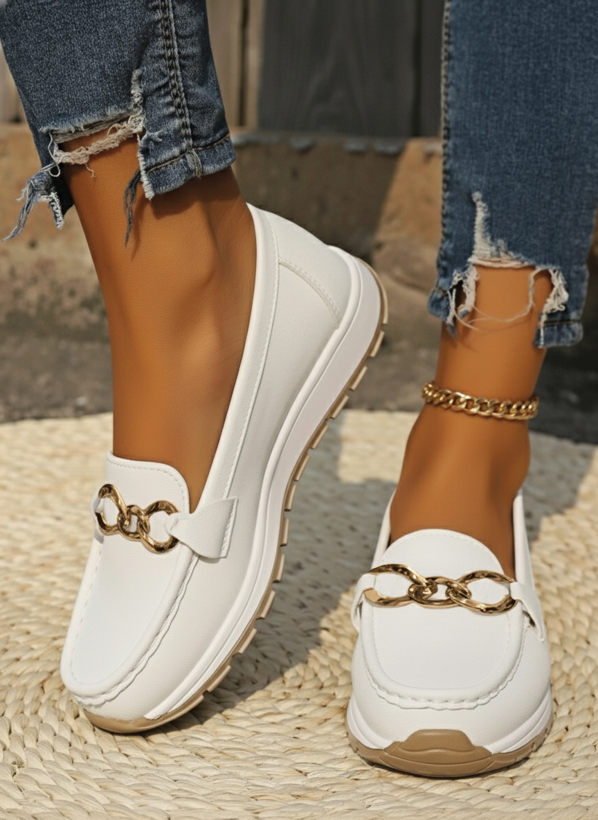 Classic women's flat loafers with a stylish buckle, offering comfort & elegance for daily outfits.