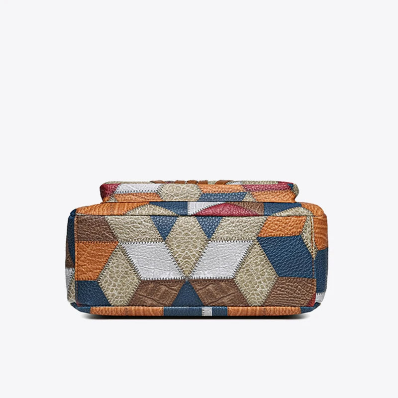 Side profile of a durable women's geometric patchwork vegan leather bag, suitable as a chic crossbody or shoulder bag.