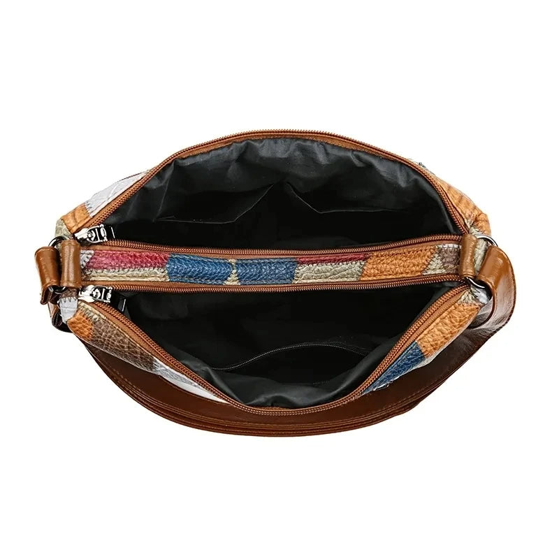 Rear view of the fashionable geometric patchwork women's handbag, a versatile and organized vegan leather accessory.