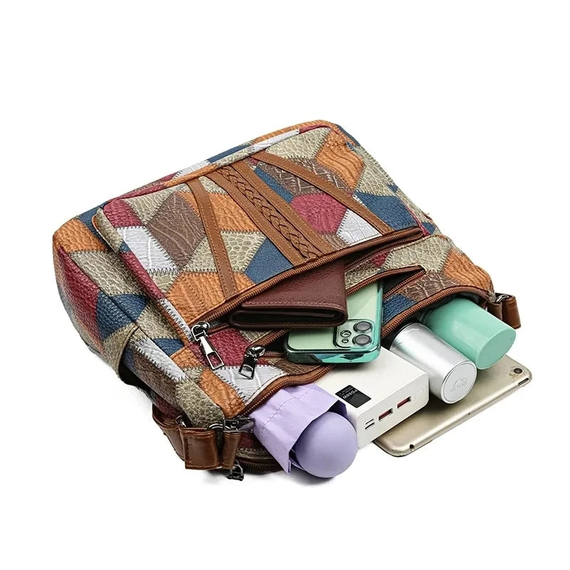 Detail of the durable hardware on the stylish geometric patchwork women's vegan leather everyday bag.
