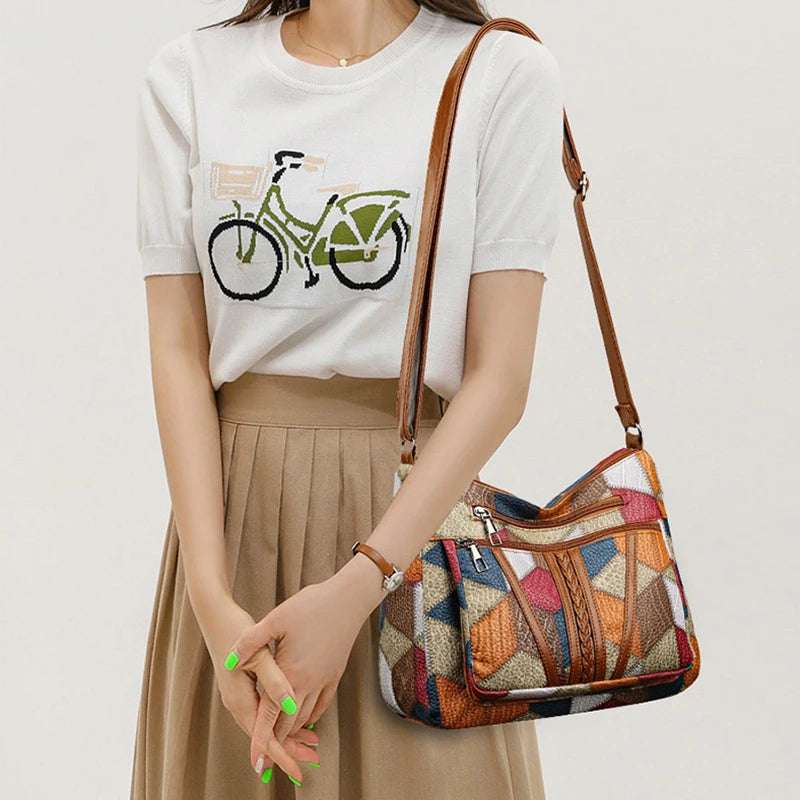 Durable geometric patchwork shoulder bag for women, an organized and fashionable everyday vegan leather accessory.