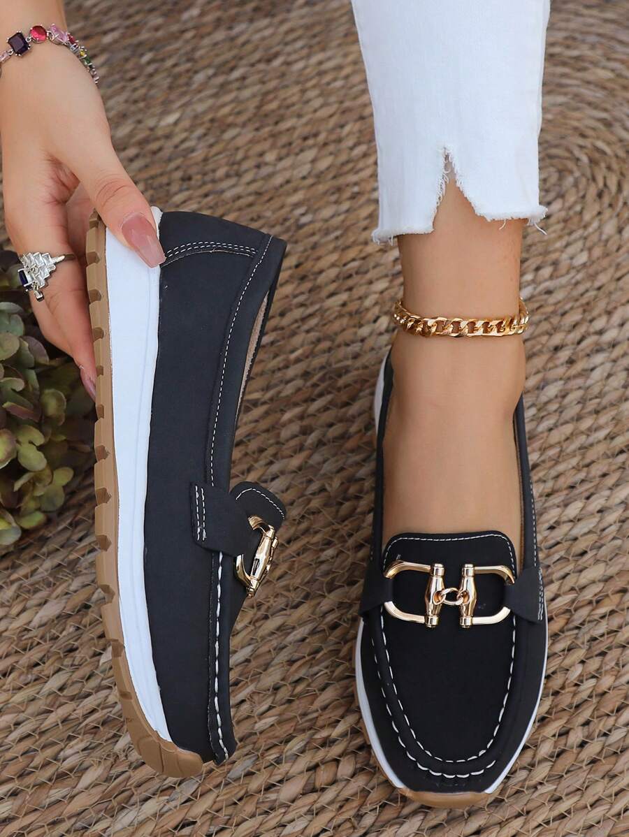 Women's flatform loafers with comfortable round toe & gold chain detail. Stylish slip-on footwear for women.