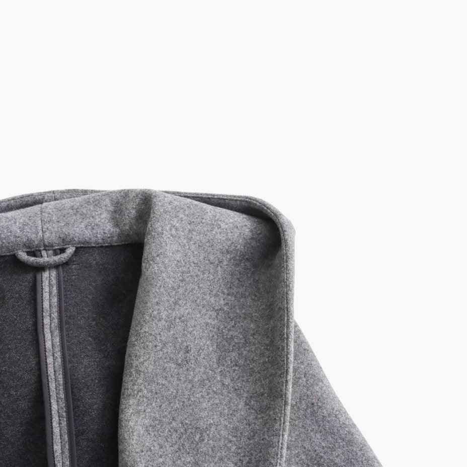 Elegant women's hooded trench coat, button front, offering weather protection for stylish spring & fall looks.