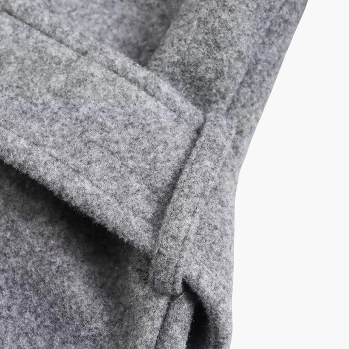 Durable women's hooded trench coat, button-front design provides weather protection for spring and fall.