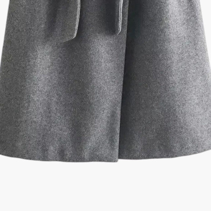 Versatile women's hooded trench coat, button front, suitable for casual fashion and weather protection.