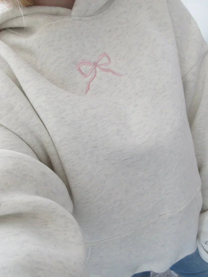 Women's stylish hoodie with an elegant bow detail, perfect for comfortable casual wear. Cozy pullover for fall fashion.