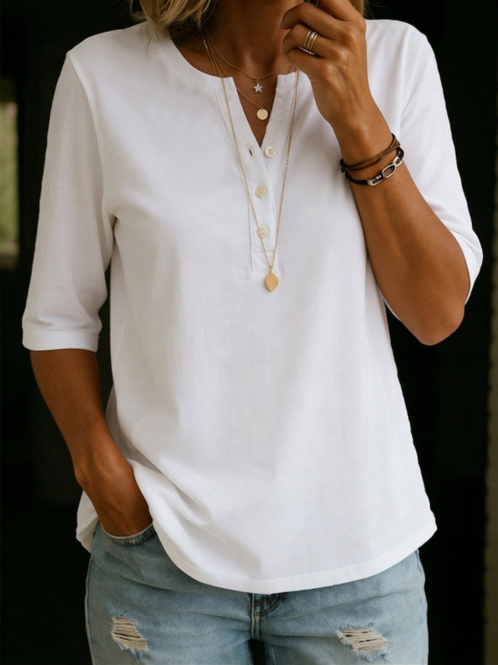 Stylish women's notch neck blouse with 3/4 sleeves, a versatile relaxed fit casual top.