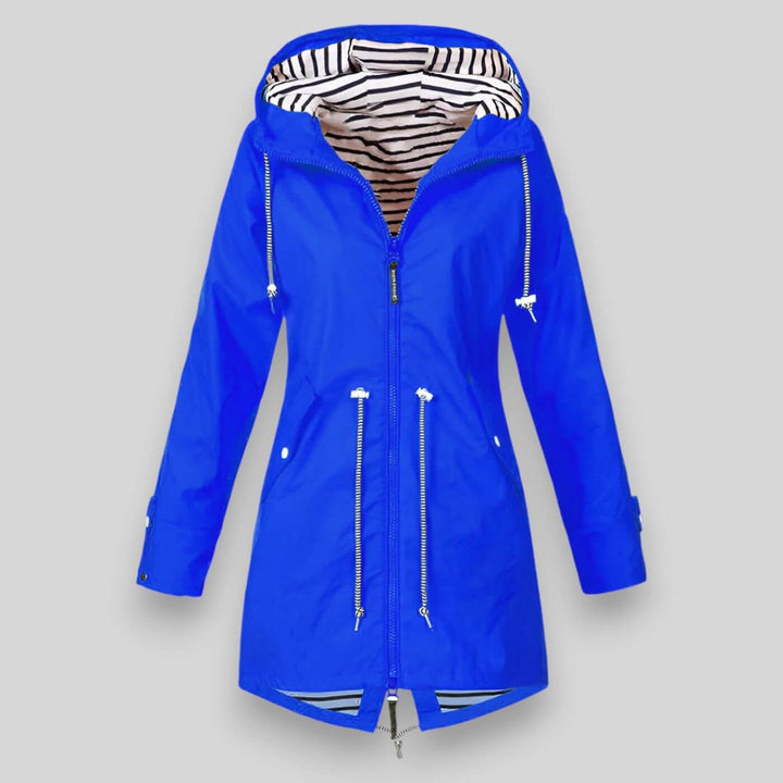 Chic women's waterproof rain jacket, essential outerwear for spring and fall, keeping you dry & stylish.