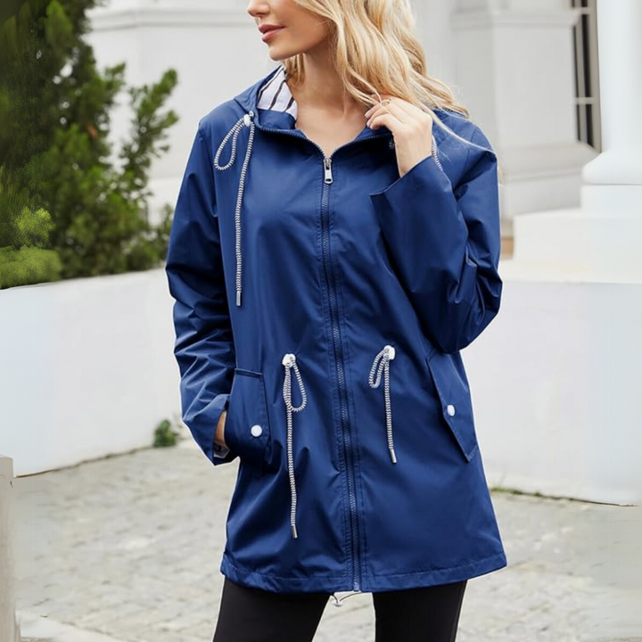 Comfortable women's waterproof rain jacket, offering stylish all-weather protection from spring to fall.