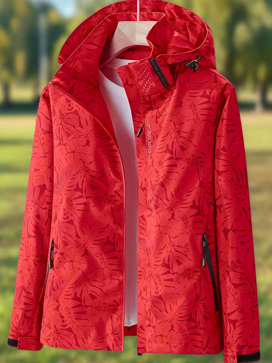 Lightweight women's waterproof summer jacket with a stylish print, featuring an adjustable fit for comfortable outdoor wear.