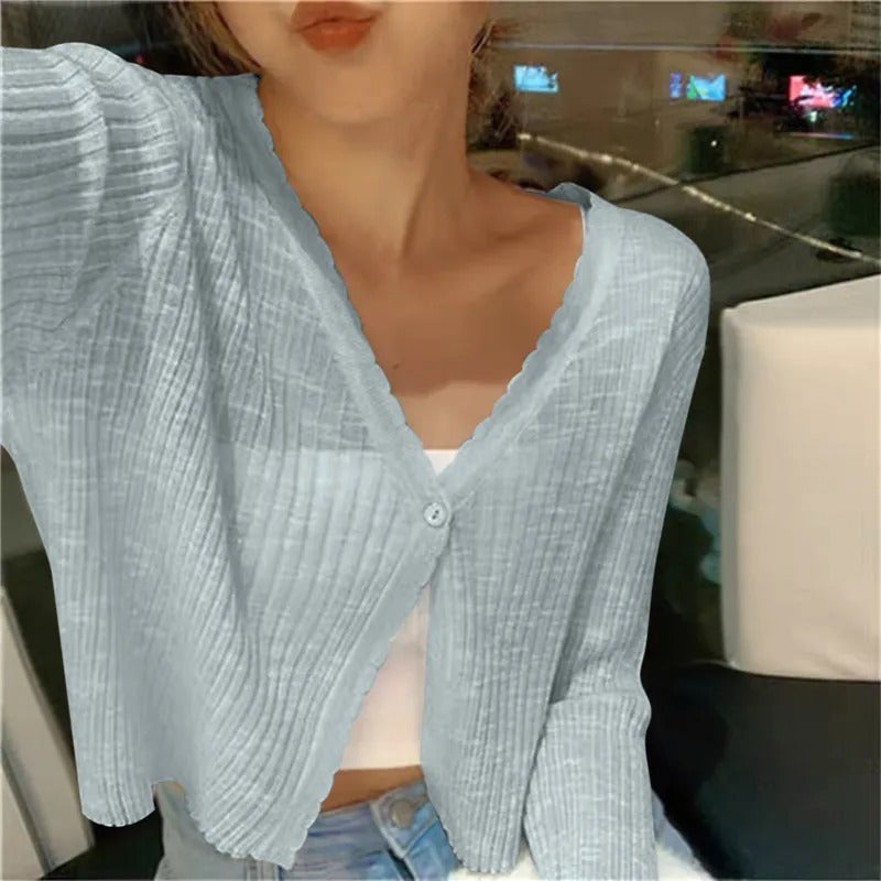 Women's summer cropped cardigan with button front, long sleeves, and V-neck. Lightweight layering top.