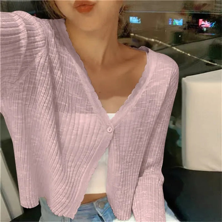 Elegant button-front cropped cardigan for women. Long-sleeve V-neck, perfect for casual summer outfits & layering.