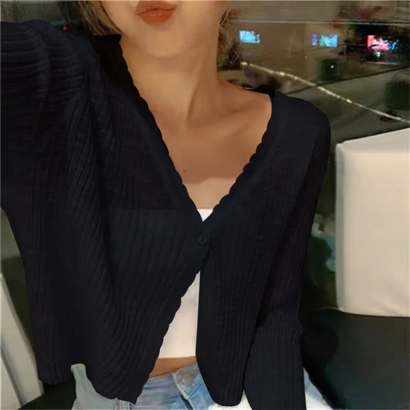 Chic women's cropped cardigan with a stylish button front. Long-sleeve V-neck design, perfect summer fashion coverup.