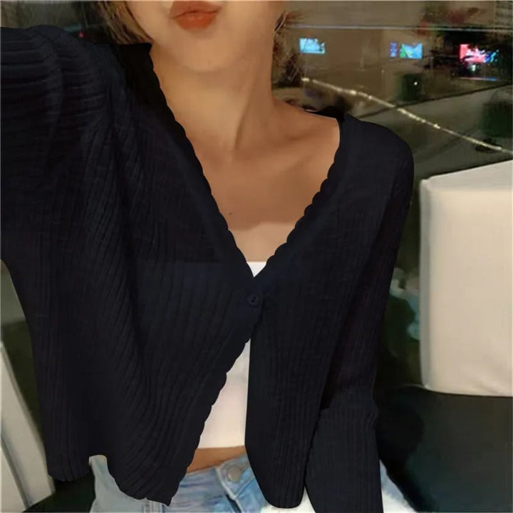 Chic women's cropped cardigan with a stylish button front. Long-sleeve V-neck design, perfect summer fashion coverup.