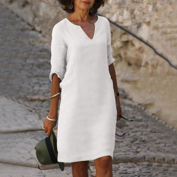 Model showcasing a versatile women's summer V-neck midi dress, ideal for various occasions.