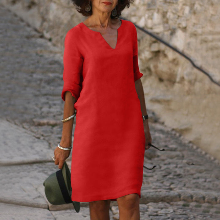Stylish V-neck midi dress, perfect for warm weather, casual outings, or elegant party wear.