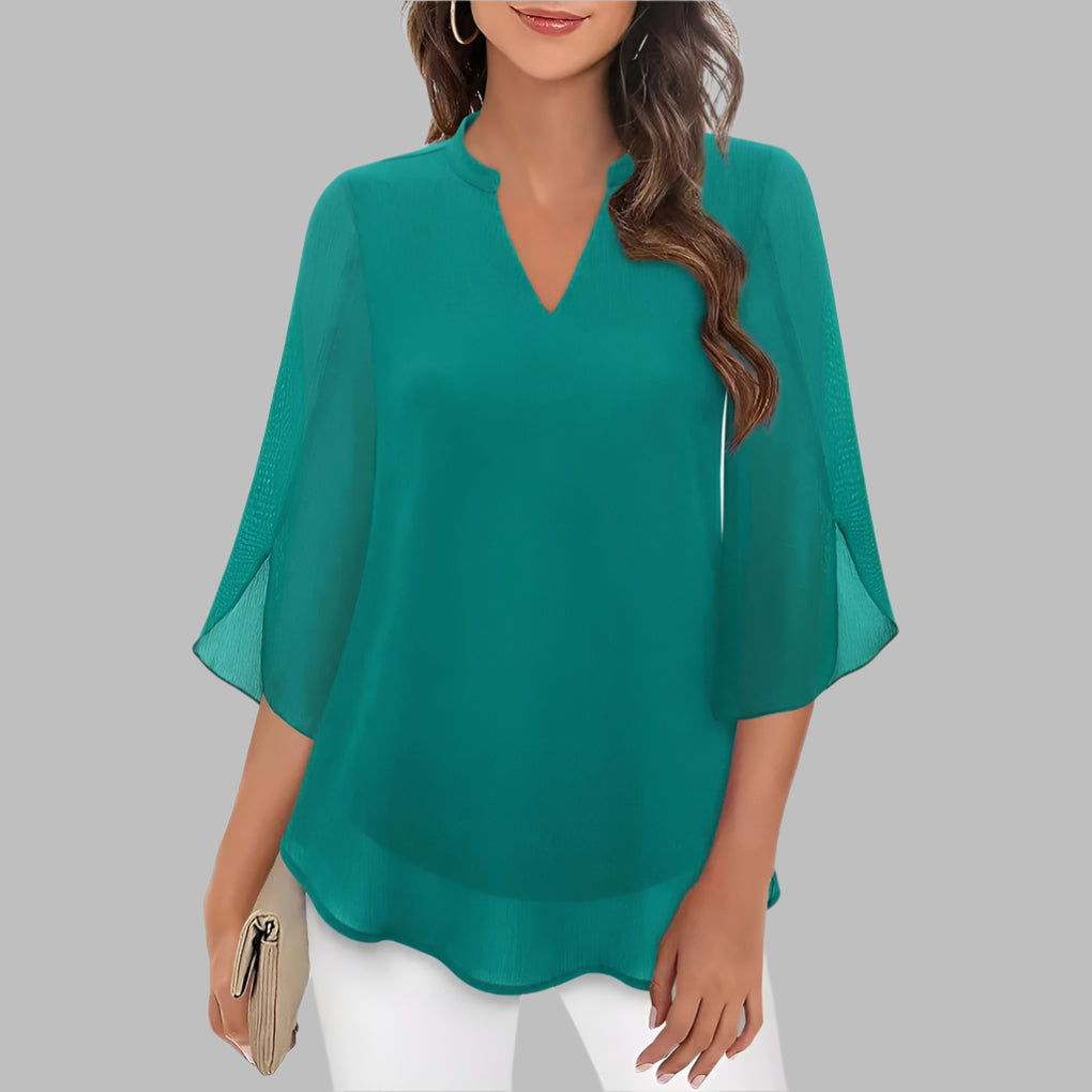 Stylish women's v-neck pullover top featuring delicate petal sleeves. A versatile short sleeve blouse for summer fashion.