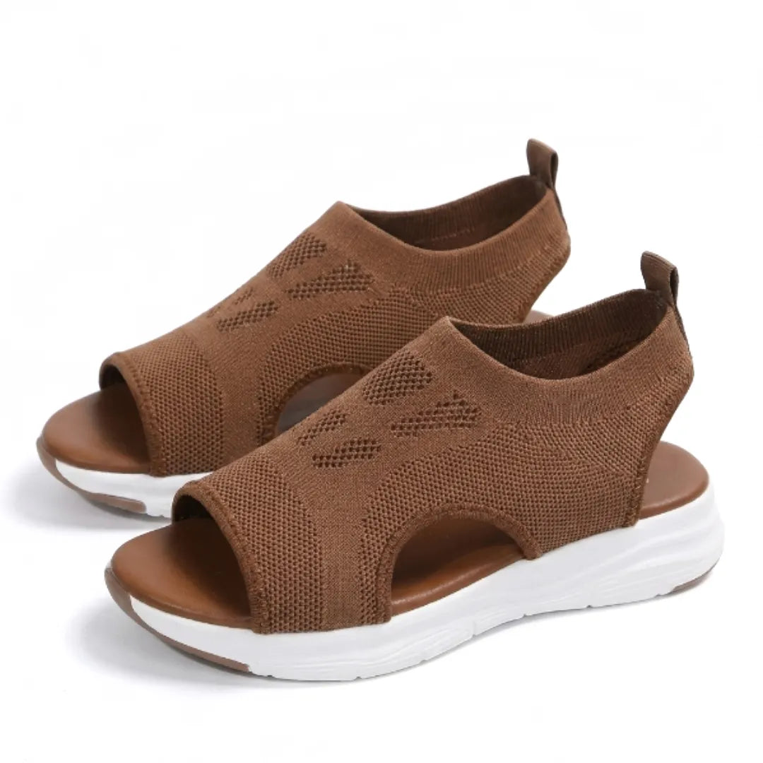 Slip-on women's comfort sandals featuring orthopedic arch support for daily wear.